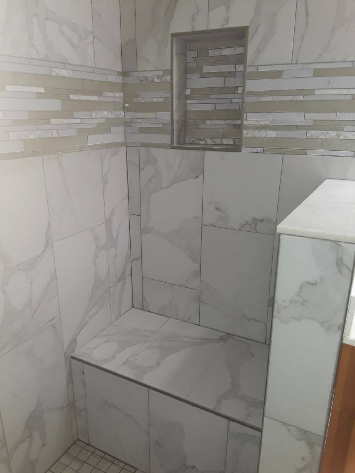 Walk-in shower with a built-in bench