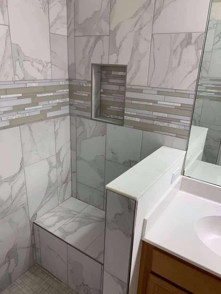 Curbless walk-in shower with a built-in seat