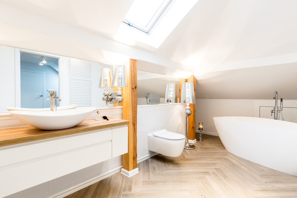 Bright small bathroom remodel with vanity and tub