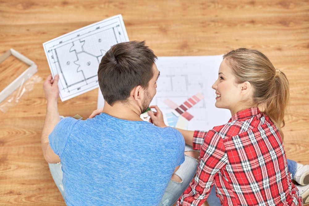 Homeowners reviewing bathroom remodel plans and finish samples