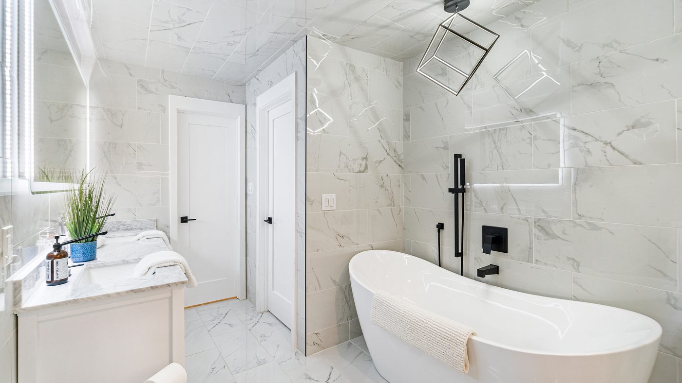 Marble master bathroom with freestanding tub and walk-in shower