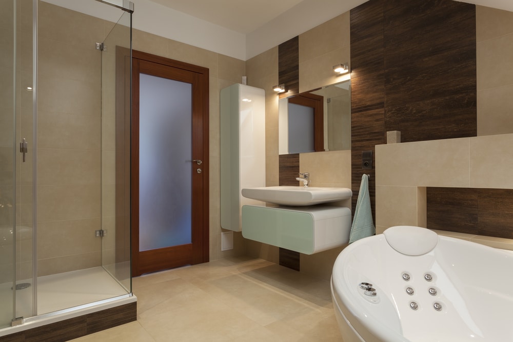 Bathroom with bathtub and glass shower for a conversion project
