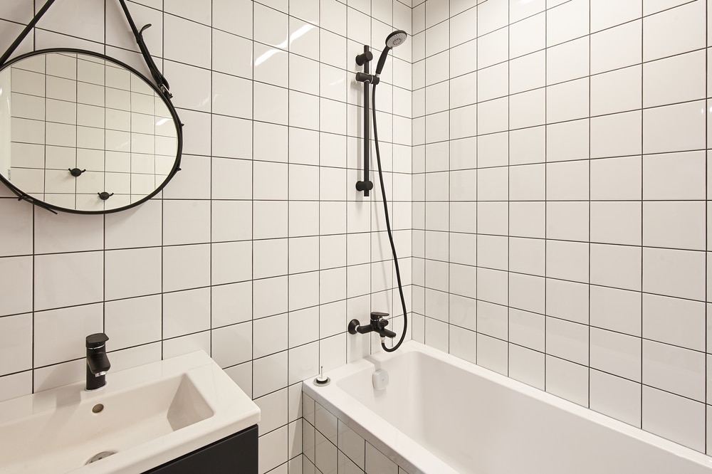 Safe walk-in shower with tiled walls and modern fixtures