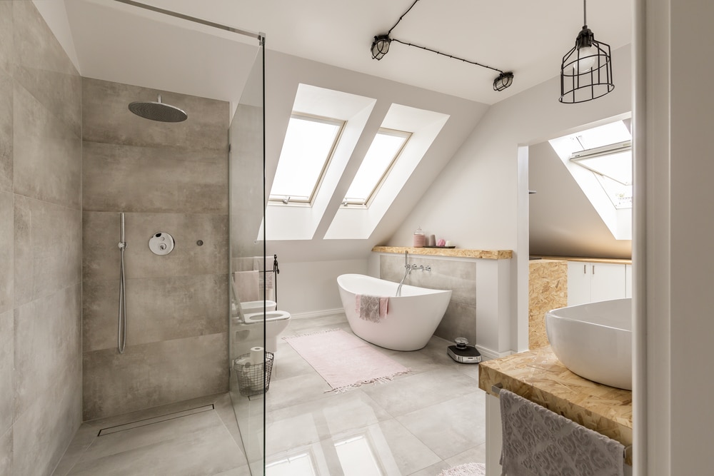 Bathroom with shower, tub, sink, and bright roof windows