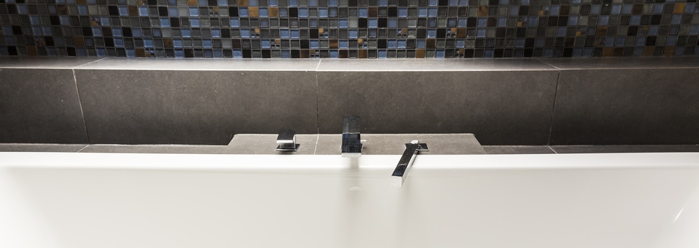 Modern bathroom faucet detail for shower conversion cost planning